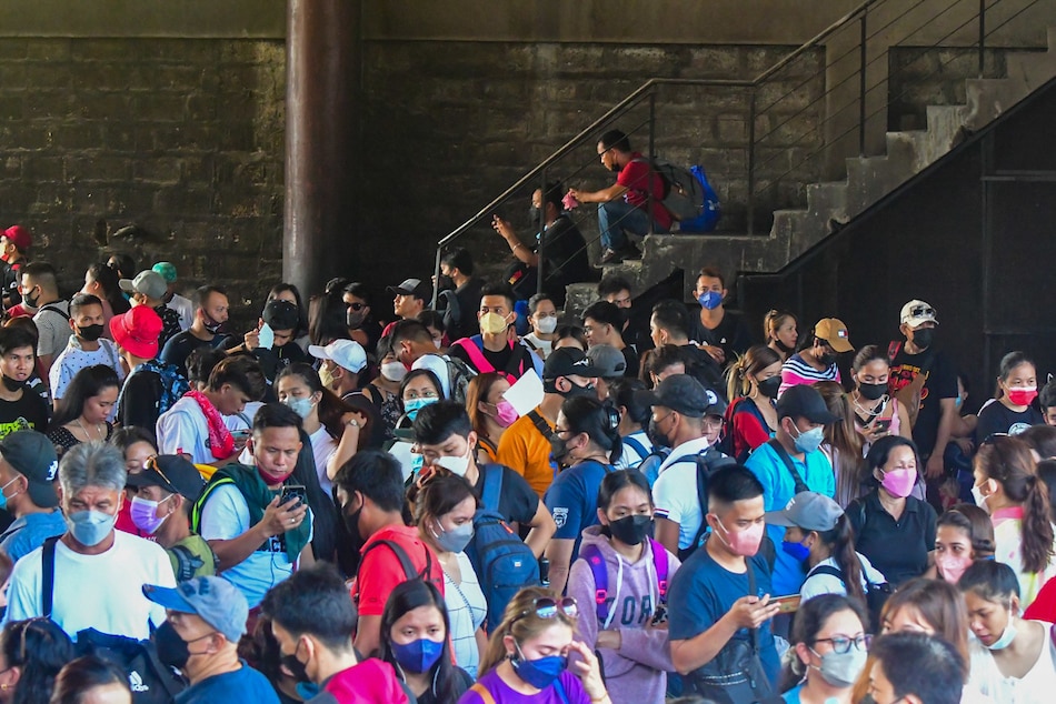 Passengers heading for the provinces crowd a bus station in Quezon City on Maundy Thursday, April 14, 2022. Looser travel restrictions and lower COVID-19 cases have allowed more people to travel back to the provinces for the long weekend after two years in lockdown. Mark Demayo, ABS-CBN News