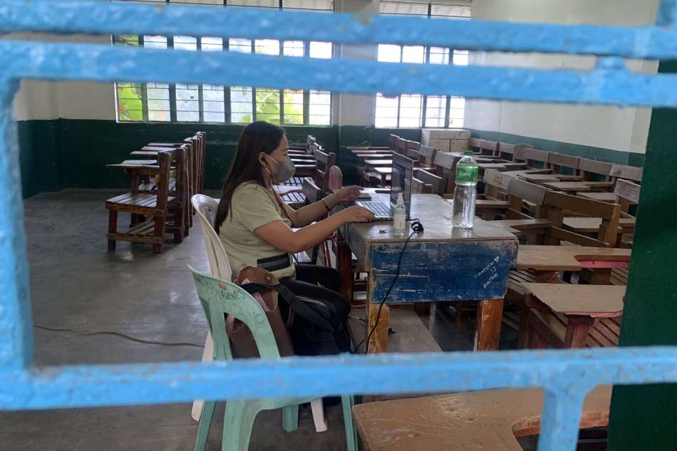 A teacher works on her laptop inside one of the classrooms of a public elementary school in Quezon City. Photo courtesy of Ruby Ana Bernardo