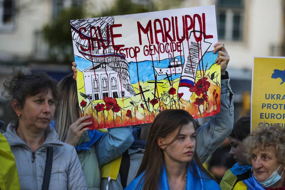 People participate in #SaveMariupol demonstration called by the Association of Ukrainians in Portugal to draw attention to the 'genocide' of the Ukrainian people and the critical situation in Mariupol, Lisbon, Portugal, April 20, 2022. Antonio Cotrim, EPA-EFE 