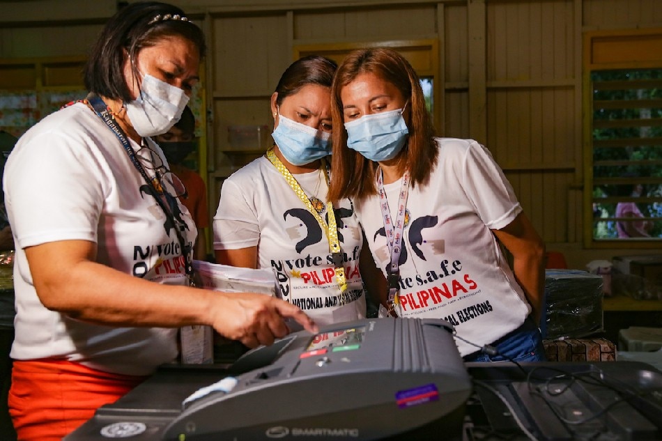 Poll workers prepare election equipment at the Kiamba Central Elementary School in Sarangani province on May 9, 2022. George Calvelo, ABS-CBN News