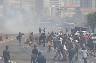 Hundreds defy Sri Lanka curfew after deadly unrest