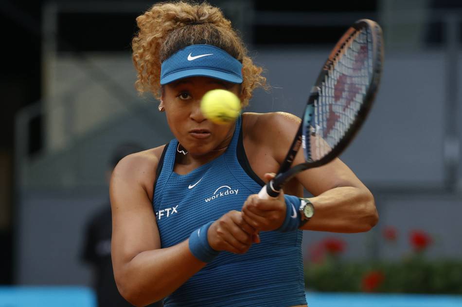 Japan's Naomi Osaka in action during her women's singles round of 32 match against Spain's Sara Sorribes at the Mutua Madrid Open's tennis tournament at the Caja Magica in Madrid, Spain, 01 May 2022. Juanjo Martin, EPA-EFE.