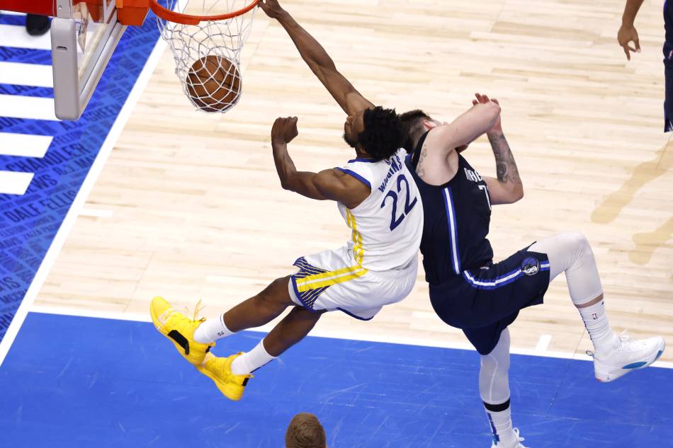 Andrew Wiggins #22 of the Golden State Warriors dunks the ball against Luka Doncic #77 of the Dallas Mavericks during the fourth quarter in Game Three of the 2022 NBA Playoffs Western Conference Finals at American Airlines Center on May 22, 2022 in Dallas, Texas. Ron Jenkins, Getty Images/AFP
