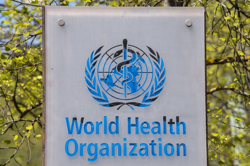 The logo and building of the World Health Organization (WHO) headquarters in Geneva, Switzerland, April 15, 2020. Martial Trezzini, EPA-EFE/File