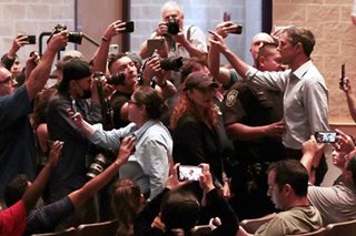 Rival confronts Texas governor over school shooting
