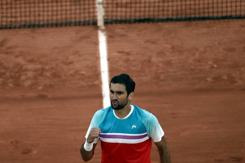 Marin Cilic of Croatia reacts after winning against Andrey Rublev of Russia in their men’s quarterfinal match during the French Open tennis tournament at Roland ​Garros in Paris, France, 01 June 2022. Yoan Valat, EPA-EFE
