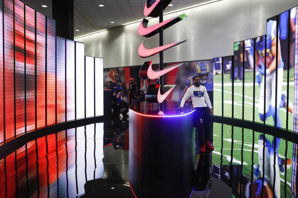 A fan poses at a Nike video display at the NFL Experience in Los Angeles, California, USA, 06 February 2022. The Los Angeles Rams are scheduled to play the Cincinnati Bengals in Super Bowl LVI on 13 Februrary 2022. EPA-EFE/CAROLINE BREHMAN/FILE