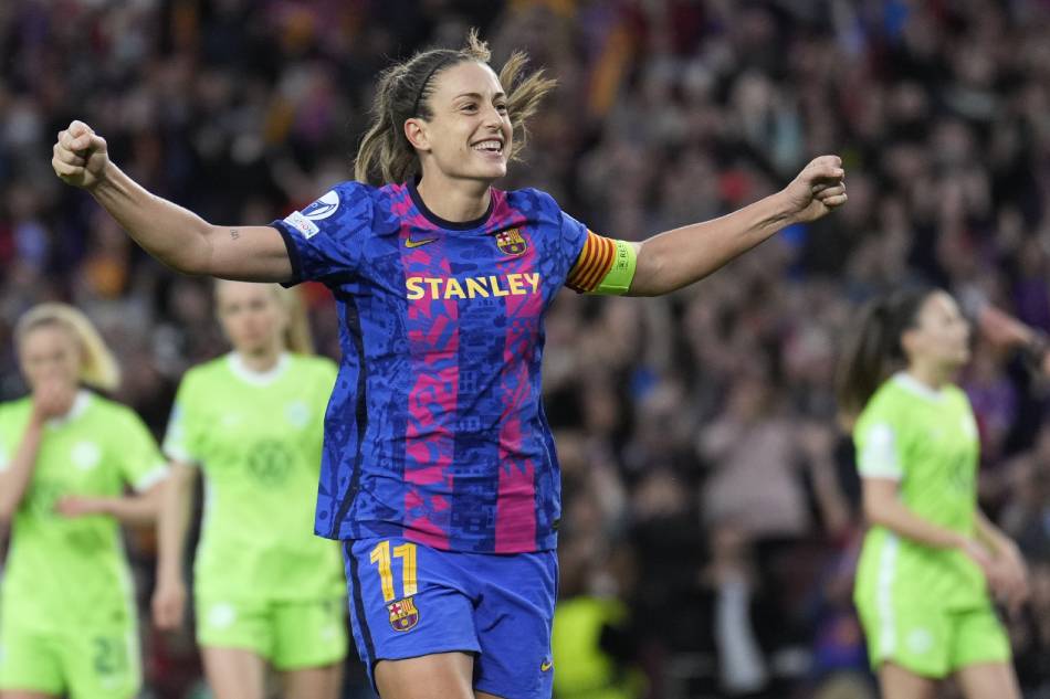 Barcelona's Alexia Putellas celebrates with teammates after scoring the 5-1 goal during the UEFA Women Champions League semi final first leg soccer match between FC Barcelona and Wolfsburg held at Camp Nou Stadium, in Barcelona, Spain, 22 April 2022. Alejandro Garcia, EPA-EFE.