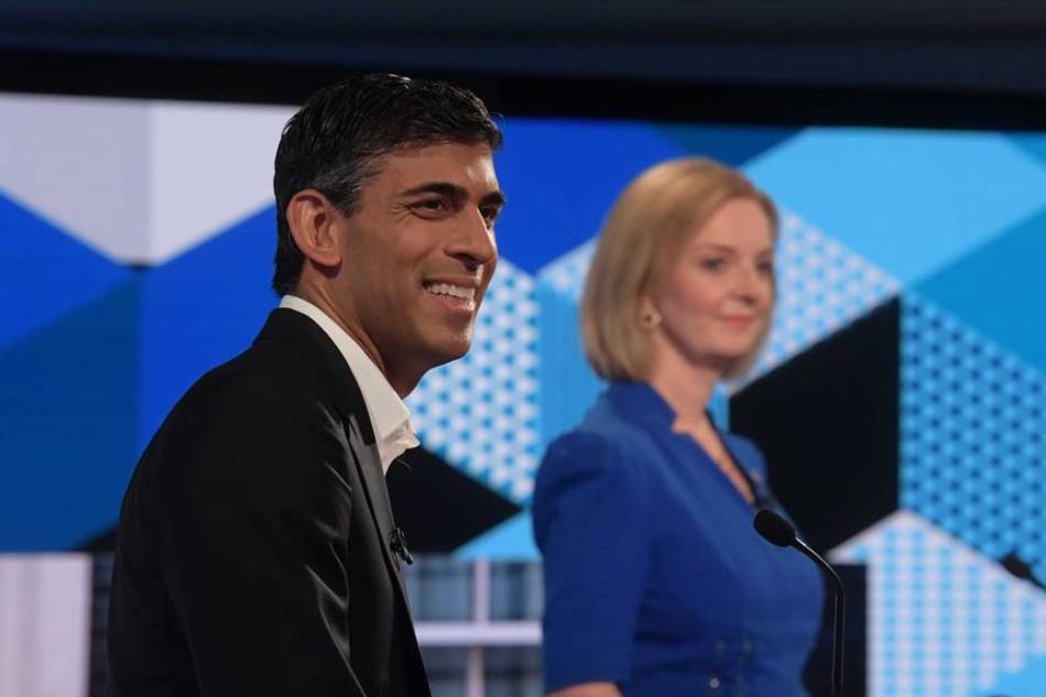 A handout photo made available by the BBC shows Former British Chancellor of the Exchequer Rishi Sunak (L) and British Foreign Secretary Liz Truss at the BBC Debate 