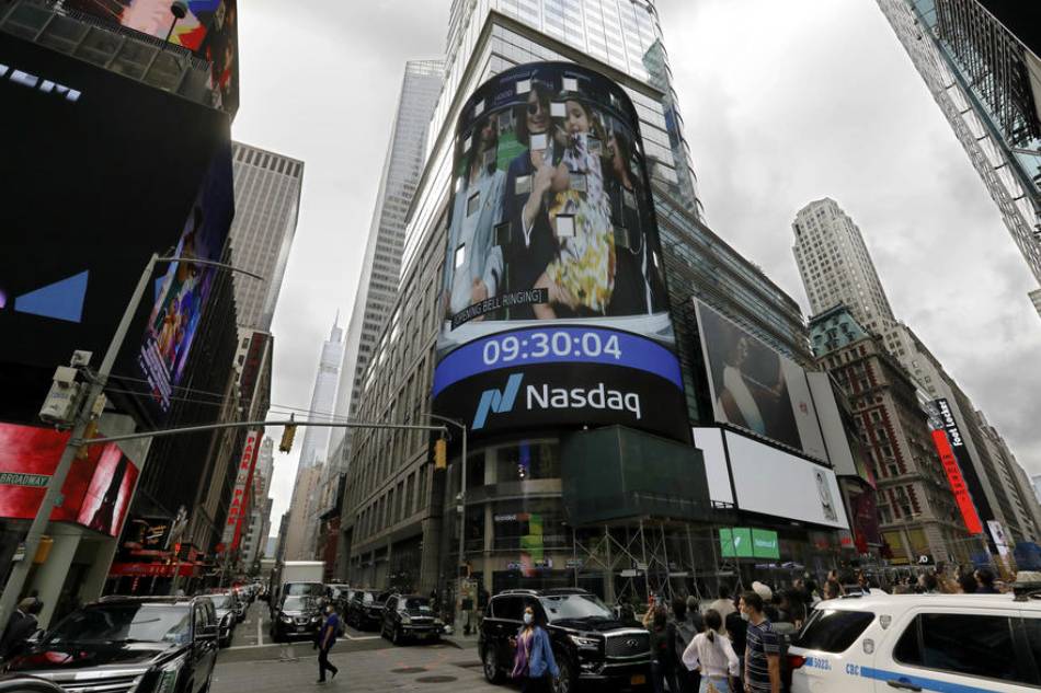Vladimir Tenev, Bulgarian-American billionaire entrepreneur co-founder and CEO of Robinhood Financial LLC, is seen with his family on the Nasdaq stock exchange building screen for the company's initial public offering in New York, New York, USA, 29 July 2021. EPA-EFE/PETER FOLEY/FILE