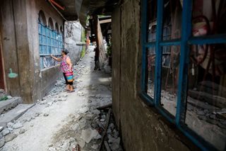 Picking up debris in Bangued, Abra 