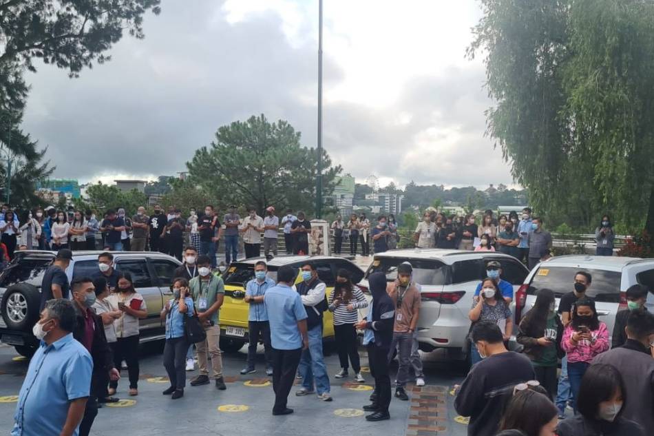 People stay in an open space in Baguio City after a magnitude 7.0 earthquake rattled parts of Luzon. Baguio City Public Information Office