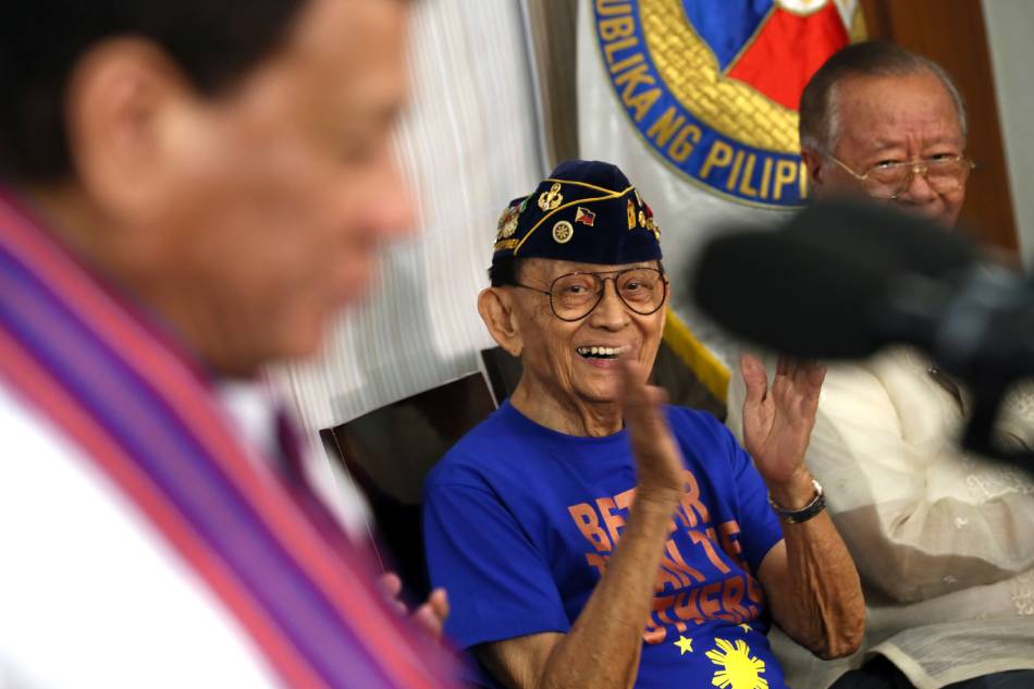 Former President Fidel V. Ramos applauds as President Rodrigo Roa Duterte congratulates him for the successful launch of the former President's book 'Make Change Work' at Camp General Emilio Aguinaldo in Quezon City on July 17, 2017. Robinson Ninal, Malacanang Photo/FILE