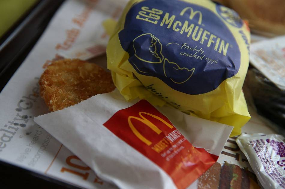 A McDonald's Egg McMuffin and hash browns are displayed at a McDonald's restaurant on July 23, 2015 in Fairfield, California. McDonald's has been testing all-day breakfast menus at select locations in the U.S. and could offer it at all locations as early as October. (Photo illustration by Justin Sullivan/Getty Images/AFP 
