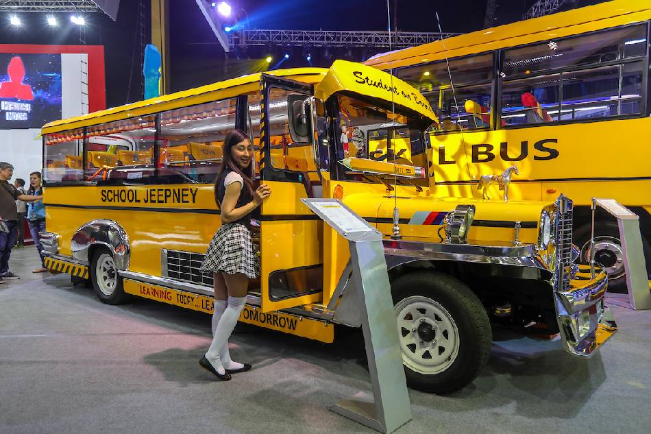 A model poses beside a school jeepney - a variation of a school bus showcased at the Philippine International Motorshow (PIMS) at the World Trade Center. Jonathan Cellona, ABS-CBN News/file