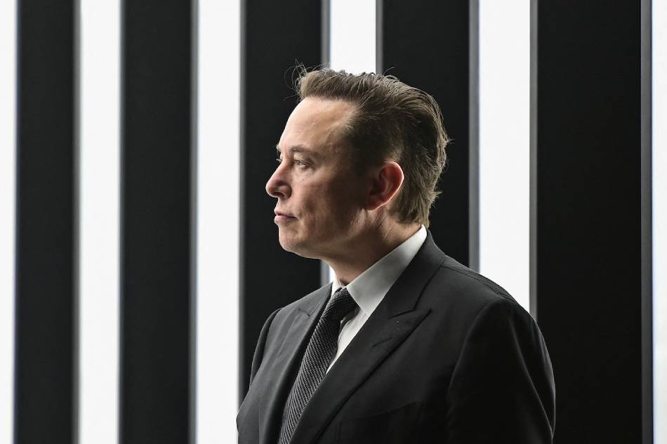 In this file photo taken on March 22, 2022, Tesla CEO Elon Musk is pictured as he attends the start of the production at Tesla's 'Gigafactory' in Gruenheide, southeast of Berlin. Patrick Pleul, POOL / AFP