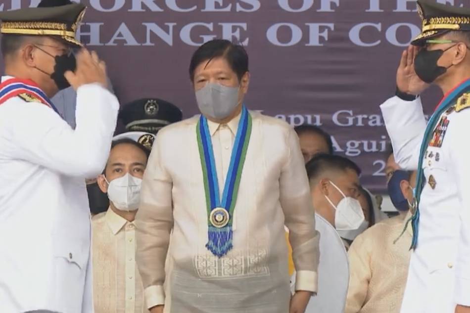 Outgoing AFP chief of staff Gen. Andres Centino (left) salutes his successor, Lt. Gen. Bartolome Vicente Bacarro, as he formally relinquished the military's command to the latter on August 8, 2022, while President Ferdinand Marcos Jr. (center) looks on. RTVM Malacañang/screengrab