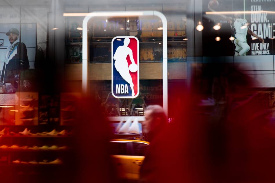 An NBA logo is shown at the 5th Avenue NBA store on March 12, 2020 in New York City. File photo. Jeenah Moon, Getty Images/AFP