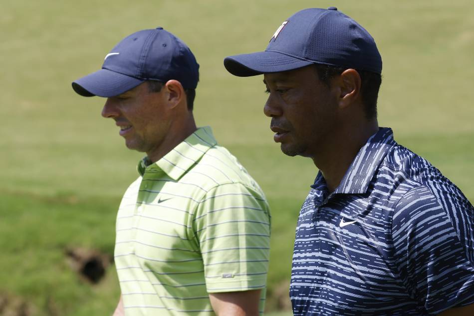 Tiger Woods of the US(R) and Rory McIlroy of Northern Ireland on the second hole during the first round of the 2022 PGA Championship golf tournament at the Southern Hills Country Club in Tulsa, Oklahoma, USA, 19 May 2022. Tannen Maury, EPA-EFE.