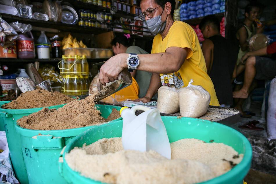 Vendors sell sugar by the kilo at the Bagong Silang public market in North Caloocan on August 11, 2022. Jonathan Cellona, ABS-CBN News/file