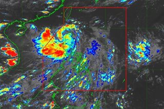 Florita slightly weakens; storm signals still up