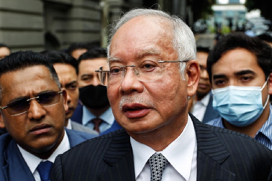 Malaysia's former prime minister Najib Razak (C) speaks during a break in his final appeal trial outside the Federal Court in Putrajaya, Malaysia, on August 23, 2022. Ahmad Luqman Ismail, EPA-EFE