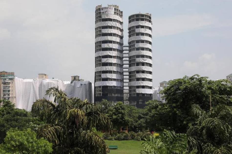 A general view of the Supertech twin towers in Noida, Uttar Pradesh, India, Aug. 25, 2022. The two 40-story towers owned by prominent Indian construction company Supertech will be demolished on 28 August for illegal building using 3,700 kg of explosives after approval by the Supreme Court, and is expected to leave behind 35,000 cubic meters of debris. Harish Tyagi, EPA-EFE 