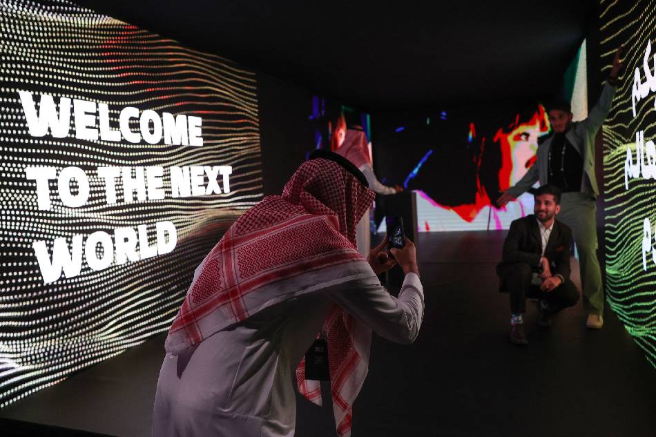 People attend the International E-Sport Gamers forum 'Next World', in the Saudi capital Riyadh, on Sept. 7, 2022. Much like with Formula One and professional golf, Saudi Arabia, the world's biggest oil exporter has in recent years leveraged its immense wealth to assert itself on the eSports stage, hosting glitzy conferences and snapping up established tournament organizers. Fayez Nureldine, AFP 
