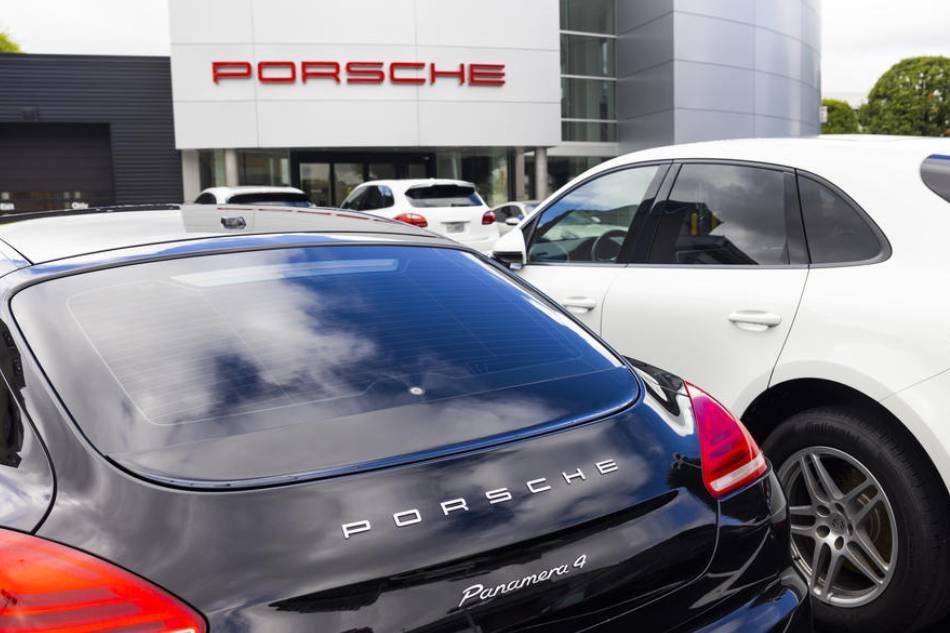 Porsches for sale at one of the brand's dealerships in Tyson's Corner, Virginia, USA, 06 September 2022. The Volkswagen Group, which owns Porsche, announced it will spin off the iconic sports car brand in an IPO this fall. EPA-EFE/JIM LO SCALZO