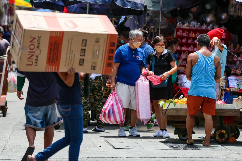 People visit stalls at the Divisoria market in Manila on September 12, 2022. President Ferdinand 'Bongbong' Marcos, Jr issued Executive Order No. 3 allowing voluntary wearing of face masks in outdoor settings, according to Press Secretary Trixie Cruz-Angeles. Jonathan Cellona, ABS-CBN News
