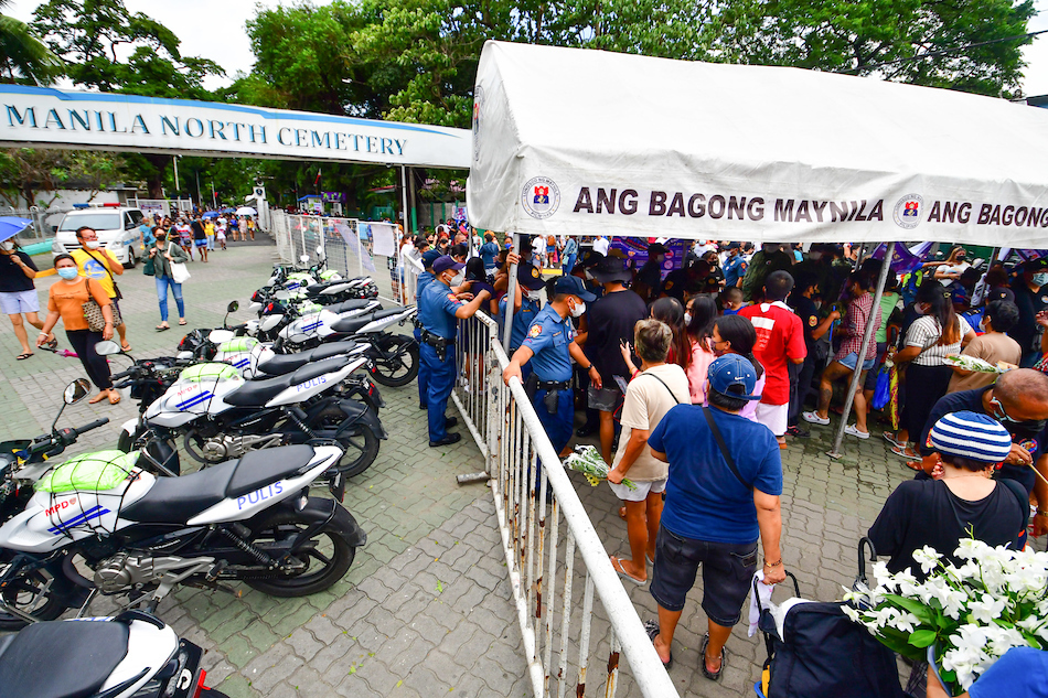 Visitors flock the Manila North Cemetery in Manila on Oct. 31, 2022, a day before All Saints Day. The cemetery was recently reopened after being cleaned up from debris and water brought by severe tropical storm Paeng. Mark Demayo, ABS-CBN News