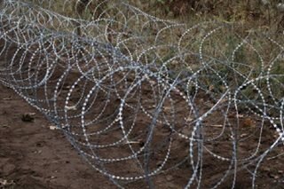 A 'barbed wire curtain': Poland fortifies its border with Russia