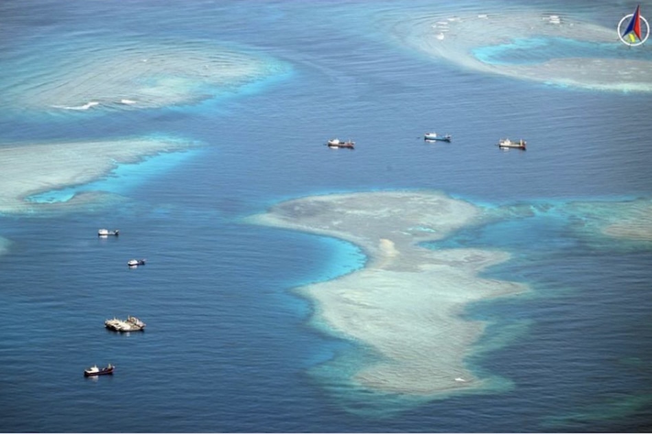 This photo was taken during an aerial patrol by the AFP Western Command in the West Philippine Sea on Nov. 23, 2022. It shows 12 Chinese fishing vessels around the eastern part of Sabina Shoal. Cherryl Tindog, AFP Western Command/handout