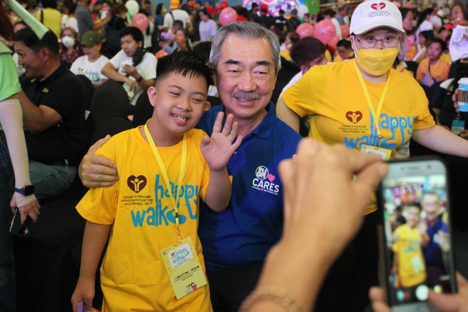 Mr. Hans Sy, Chairman of Executive Committee of SM Prime Holdings, and a long-time supporter of PWD activities and events, celebrated with the kids and families at #HappyWalk2023. Photo source: SM Cares