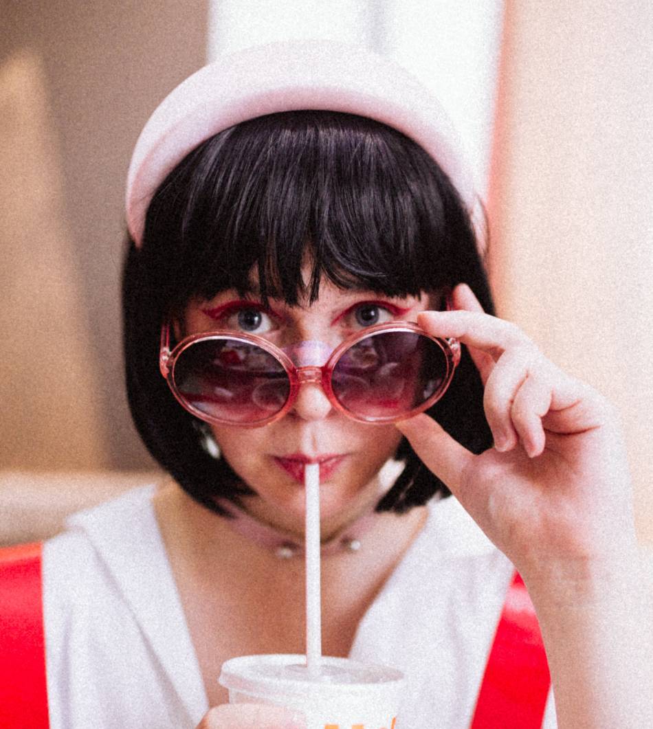 Photo source: Pexels [LINK OUT 'Pexels': https://www.pexels.com/photo/woman-in-red-and-white-top-drinking-using-white-straw-13278263/