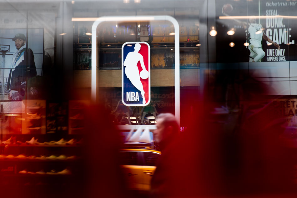  An NBA logo is shown at the 5th Avenue NBA store on March 12, 2020 in New York City. Jeenah Moon/Getty Images/AFP