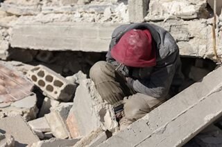 Syrian man digs for 30 relatives buried by quake