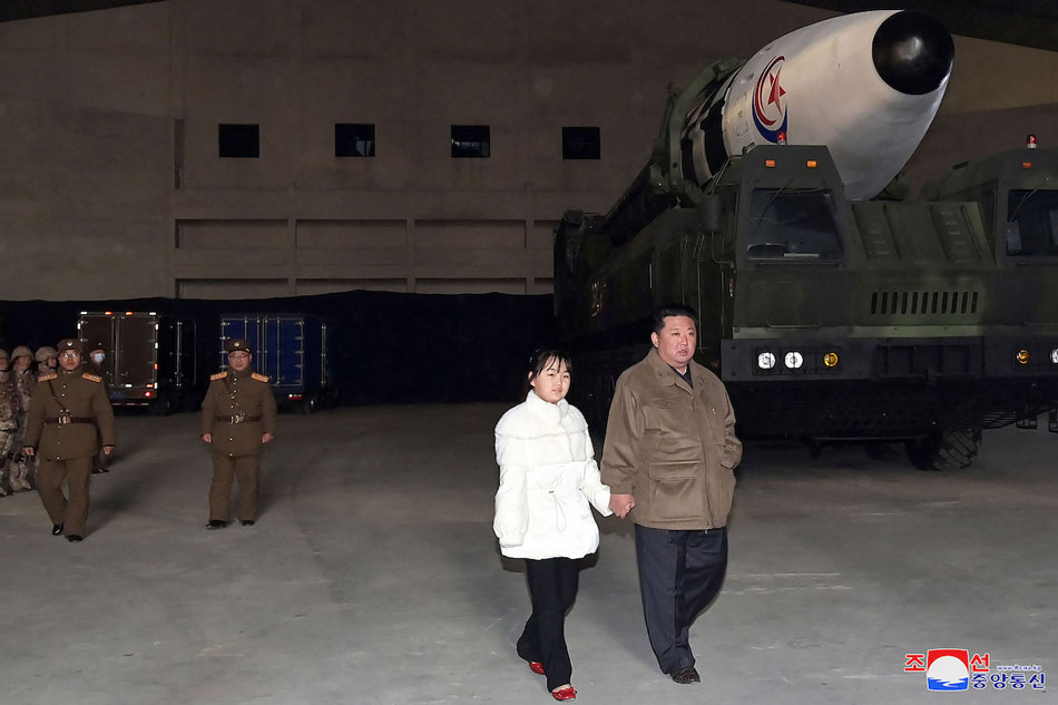 This picture taken on Nov. 18, 2022 and released from North Korea's official Korean Central News Agency (KCNA) on Nov. 19, 2022 shows North Korea's leader Kim Jong Un (R) walking with his daughter as he inspects a new intercontinental ballistic missile (ICBM) 'Hwasong Gun 17', ahead of its launch at Pyongyang International Airport. North Korean leader Kim Jong Un said he would respond to US threats with nuclear weapons, state media said on Nov. 19, after Kim personally oversaw Pyongyang's latest launch of intercontinental ballistic missile. KCNA via KNS/AFP