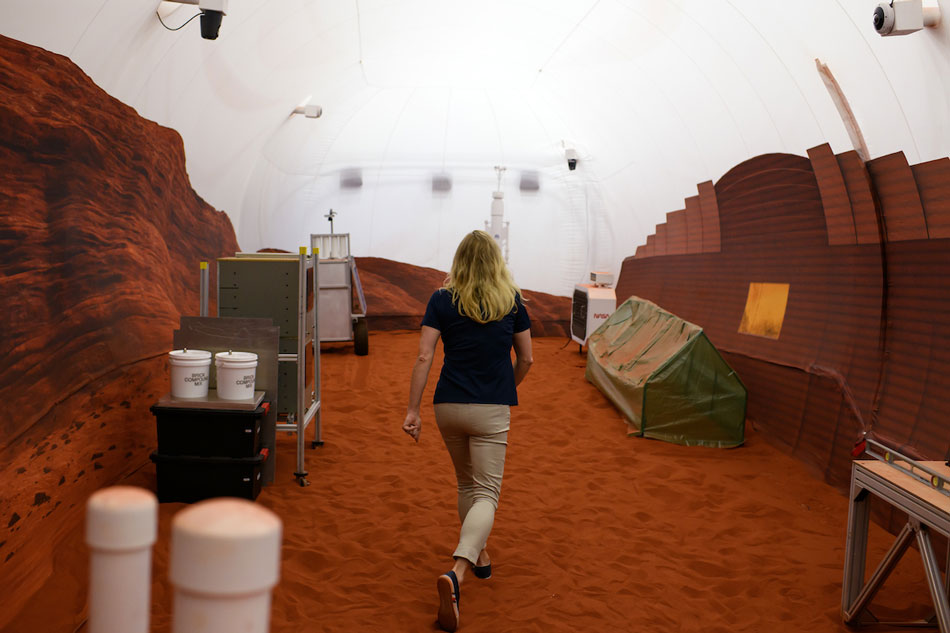 Dr. Suzanne Bell, Lead for NASA’s Behavioral Health and Performance Laboratory, walks through a simulated Mars exterior portion of the CHAPEA’s Mars Dune Alpha at the Johnson Space center in Houston, Texas on April 11, 2023. CHAPEA’s Mars Dune Alpha is a 3D printed habitat designed to serve as an analog for one-year missions. Mark Felix, AFP
