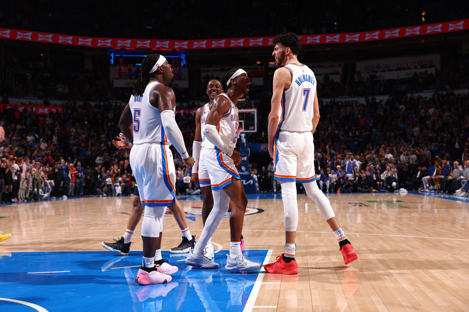 Shai Gilgeous-Alexander (2) and Chet Holmgren (7) of the Oklahoma City Thunder celebrate during the game against the Golden State Warriors on December 8, 2023 at Paycom Arena in Oklahoma City, Oklahoma. Zach Beeker, NBAE via Getty Images/AFP