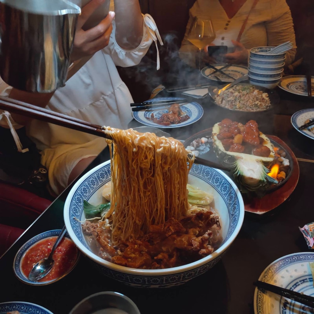 The crispy 'sheng mian' noodles feature soft-shell Hokkaido crab, scallops, and bokchoy
