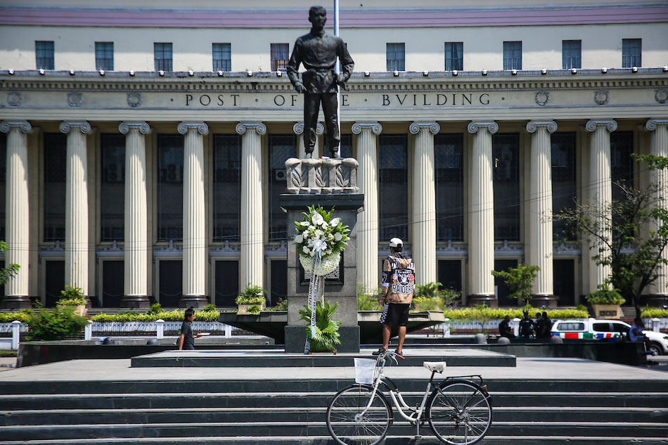 A man checks the monument of Andres Bonifacio at the Liwasang Bonifacio in Manila on August 29, 2022. Jonathan Cellona, ABS-CBN News