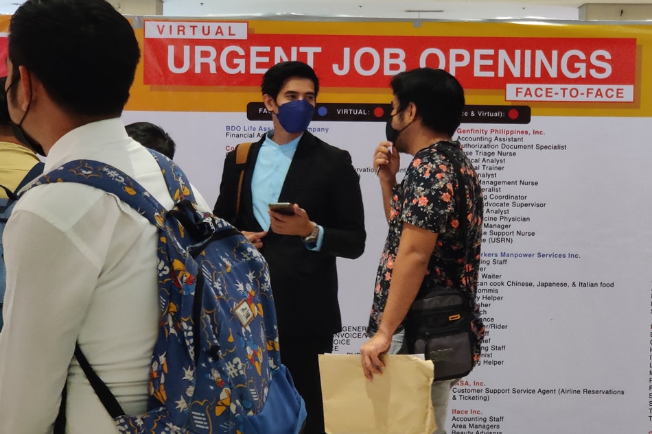 Job-seekers queue at a job fair in Quezon City on November 8, 2022. Mark Demayo, ABS-CBN News/FILE