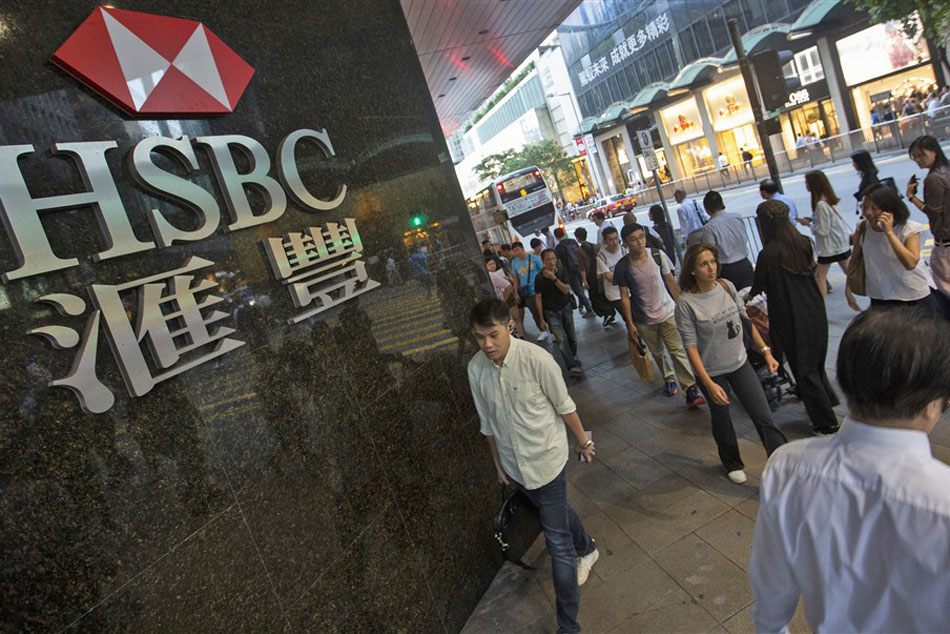 People walk past the Hong Kong and Shanghai Banking Corporation (HSBC) logo in Central District, Hong Kong, China, 29 October 2019. EPA-EFE/ALEX HOFFORD/FILE