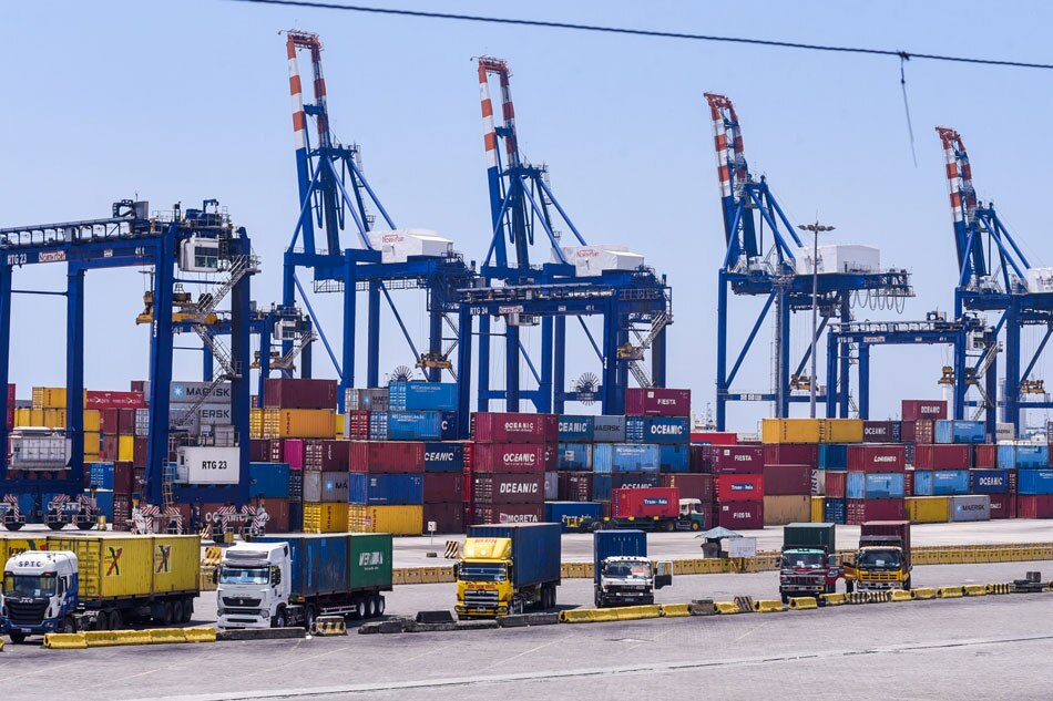 Container vans stacked together are seen inside the Philippine Ports Authority (PPA) compound in Manila on April 1, 2020. George Calvelo, ABS-CBN News