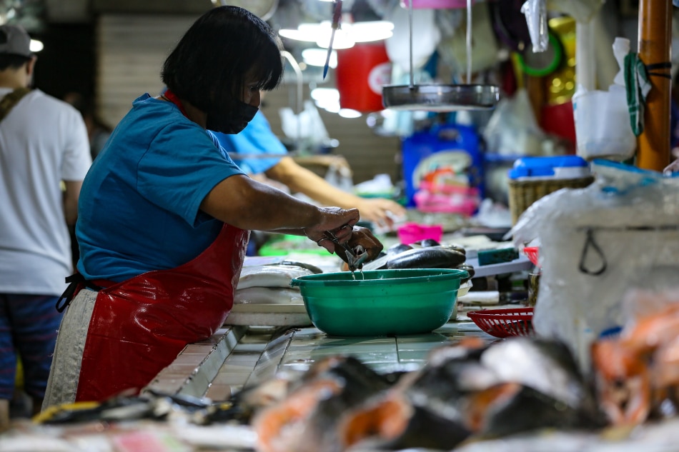 Vendors tend to their produce at the fish and meat stalls in Guadalupe Public Market in Makati City on Jan. 13, 2023. Jonathan Cellona, ABS-CBN News