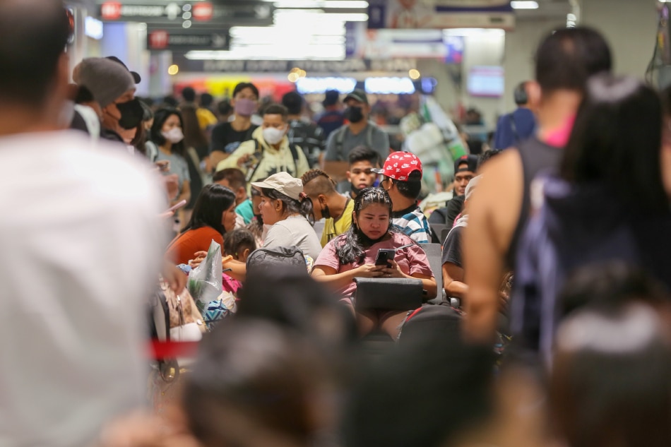 Travelers arrive and line up at the various bus queues at the Paranaque Integrated Terminal Exchange (PITX) in Paranaque City on Dec. 23, 2022 as Christmas day nears. Jonathan Cellona, ABS-CBN News/File