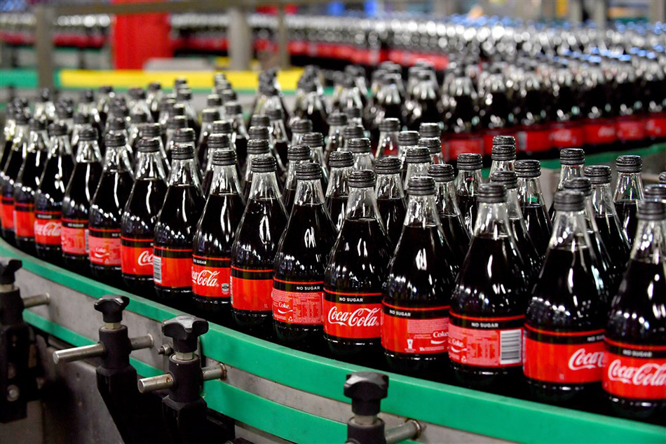 ottles of Coca-Cola No Sugar are seen on a production line in Coca-Cola
