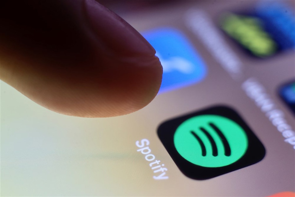 The logo of music streaming company Spotify is pictured on a smartphone in Taipei, Taiwan, 30 July 2020 (reissued 01 March 2021). EPA-EFE/RITCHIE B. TONGO/FILE
