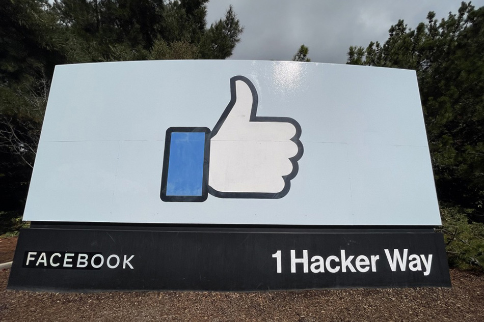 A view of a sign featuring Facebook